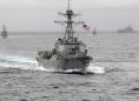 Angry China says shadowed U.S. warship near man-made islands in disputed sea